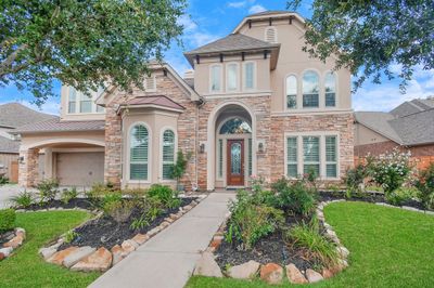 Welcome to 11306 Rossie Moor Ln in Richmond's Aliana master-planned neighborhood. This beautiful home has many luxurious features inside and out. When you arrive out front you will notice the home's upgraded stucco and stone elevation, many windows, and three car garage. | Image 1