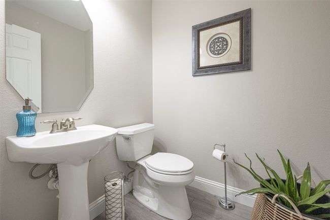 Spacious half bath near kitchen and living room for entertaining or guests. | Image 22