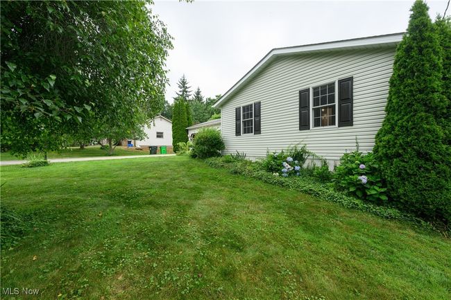 View of side of home with a yard | Image 26