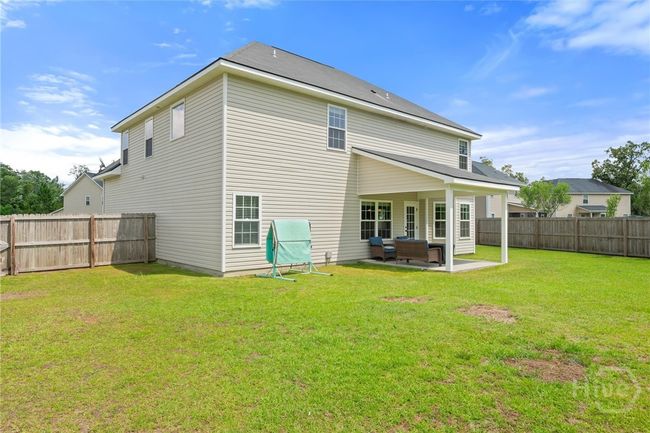 Fenced back yard with privacy fencing. | Image 38
