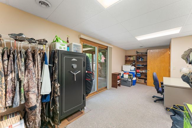 And a bonus room with another walk out to a concrete patio. | Image 29