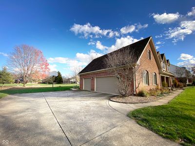 Oversized 3 car garage with plenty of parking for guests. | Image 2