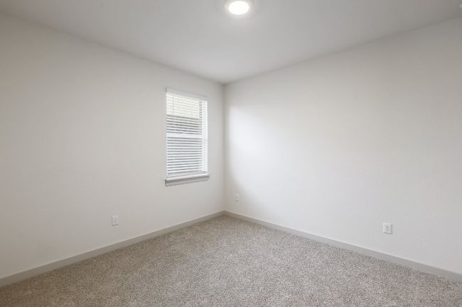 Carpeted bedroom featuring baseboards | Image 18