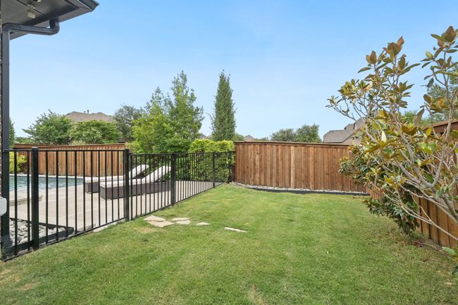 Fenced backyard featuring a patio | Image 26
