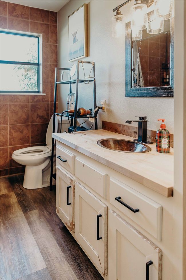 Bathroom with vanity, wood finished floors, and tile walls | Image 24