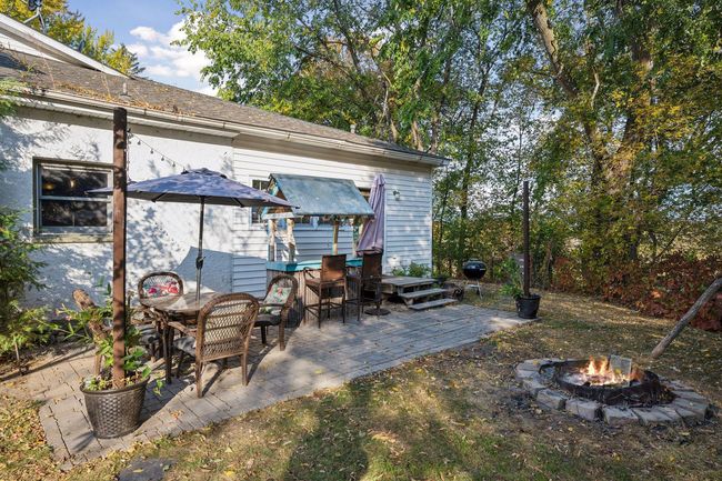The patio is set up for entertainment! Imagine relaxing fires on the patio enjoy views of Stanchfield Creek. | Image 49