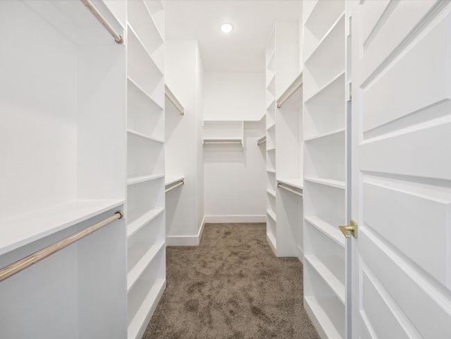 Spacious closet featuring carpet floors | Image 19