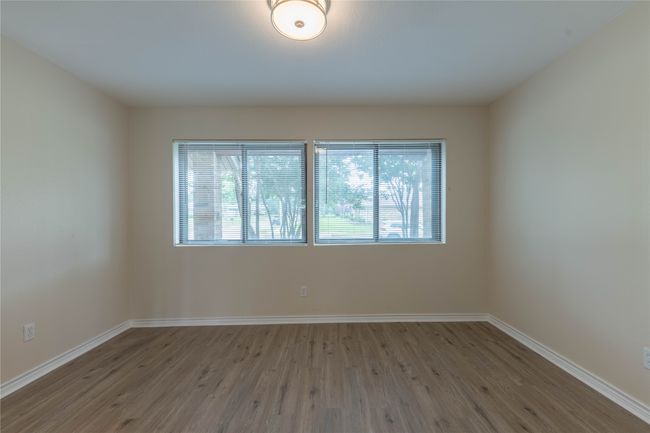 Unfurnished room featuring wood finished floors and baseboards | Image 15