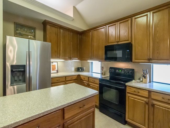 Elevated kitchen ceiling creates a wonderful work environment for the chef in the home! | Image 10