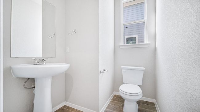 Bathroom featuring toilet and baseboards | Image 28