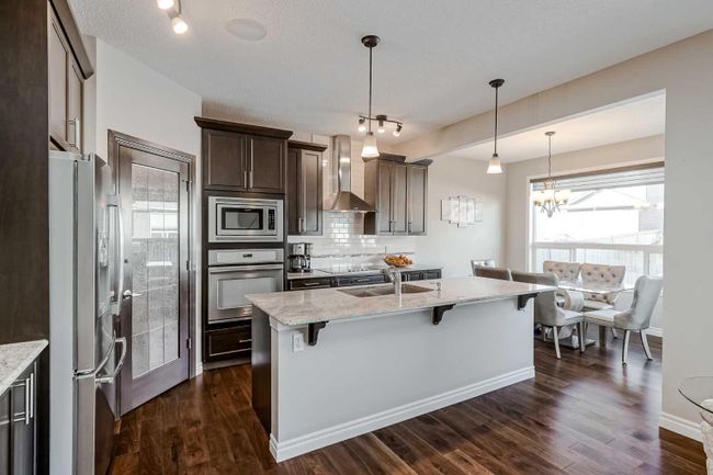 168 Cougar Ridge Manor Sw, Home with 4 bedrooms, 3 bathrooms and 4 parking in Calgary AB | Image 6