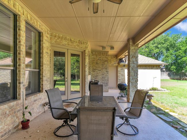 View of patio / terrace featuring french doors, ceiling fan, and outdoor dining area | Image 30