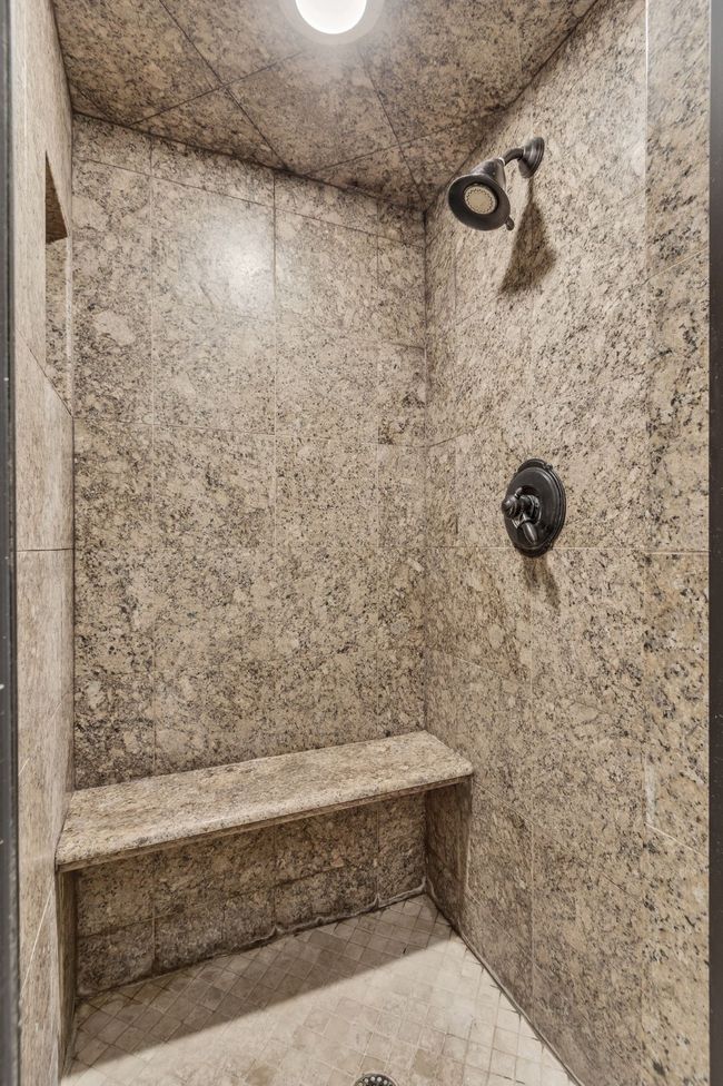 Bathroom featuring a tile shower | Image 20