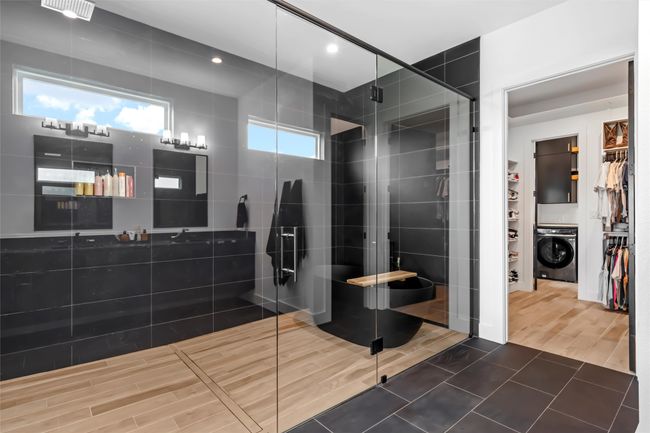 Full bathroom with a walk in closet, recessed lighting, washer / dryer, and a shower stall | Image 26