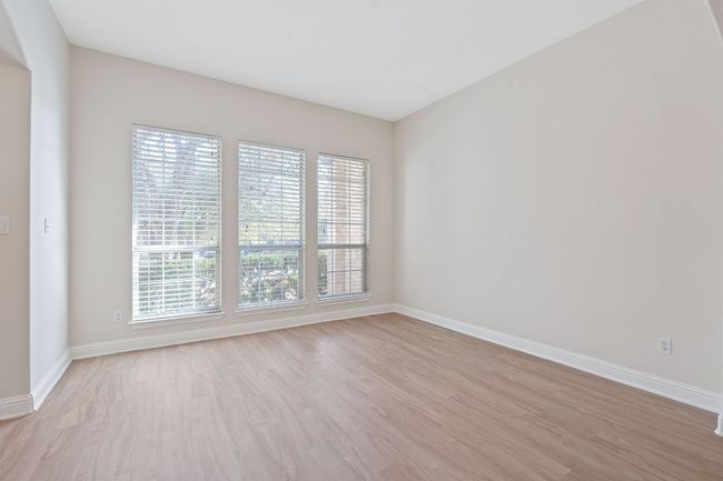 Unfurnished room with baseboards and light wood finished floors | Image 16