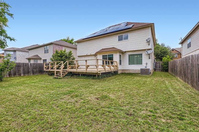 Back of house featuring a deck and cooling unit | Image 28
