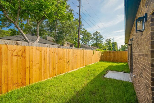 Fenced backyard with plenty of space for pets and play | Image 39