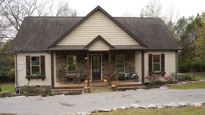 House is only 7 years old with beautiful stonework and simplicity within city limits. Quiet and secluded with gate entrance | Image 2