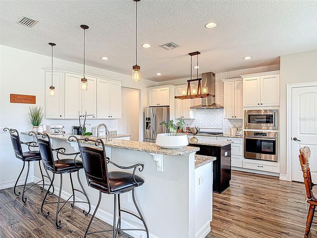 bar seating in kitchen | Image 21