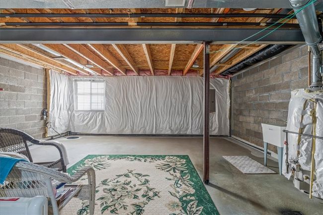 The unfinished basement provides storage space or finish for an additional living area. | Image 26
