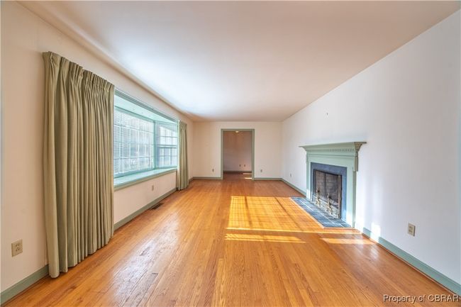 Unfurnished living room with hardwood / wood-style floors | Image 6