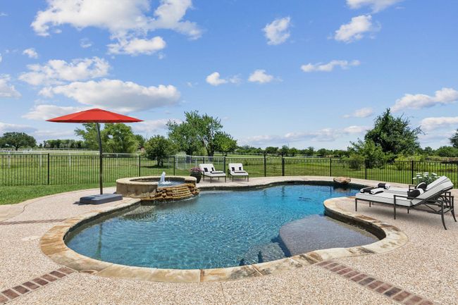 Lounging by the pool offers gorgeous views of country living. | Image 31