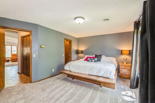Primary bedroom is located right off the living room! | Image 31