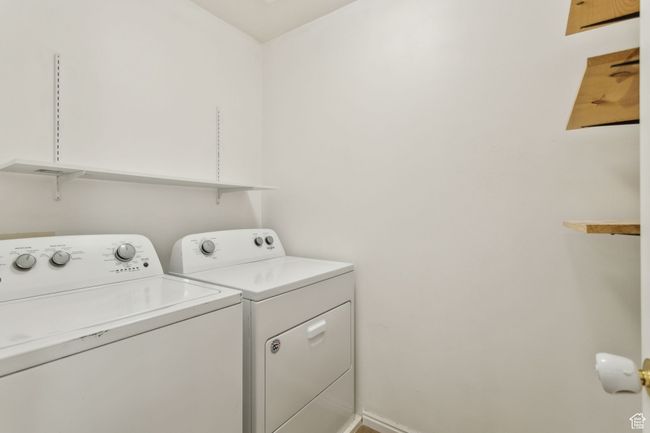 Washroom featuring washing machine and clothes dryer | Image 11