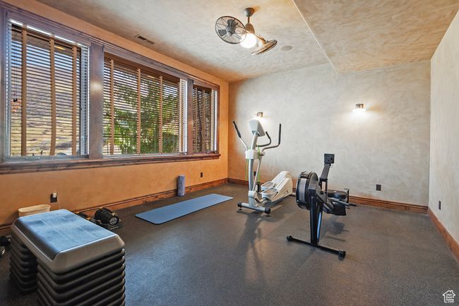 Exercise area with baseboards | Image 45