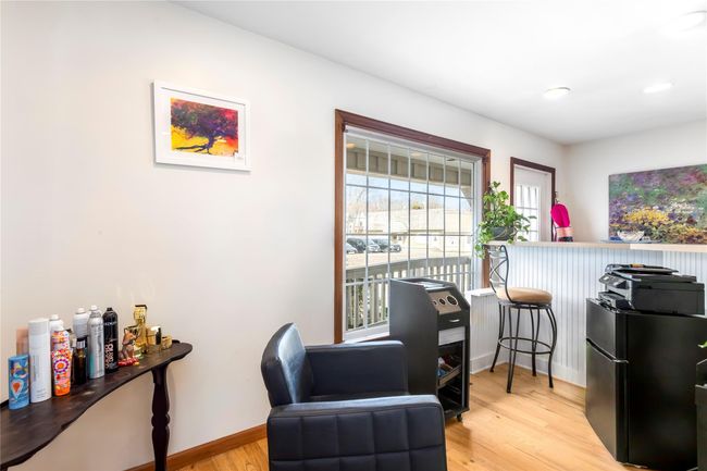 Sitting room featuring baseboards and light wood finished floors | Image 16