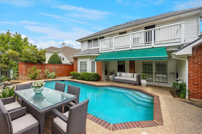 Virtually staged to show the amenities you could put around the pool. | Image 7