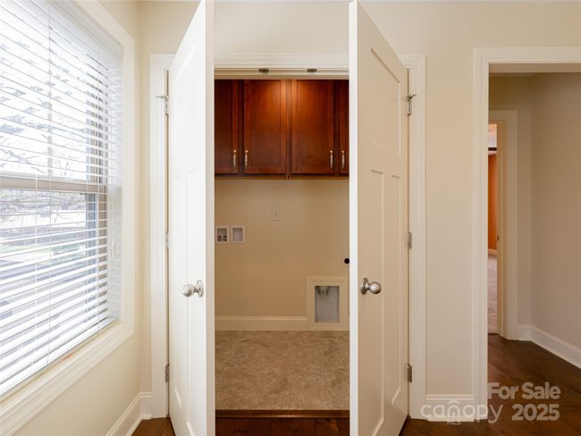Upper Laundry Area with storage | Image 21