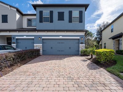 Paver drive w/ stacked stone | Image 1