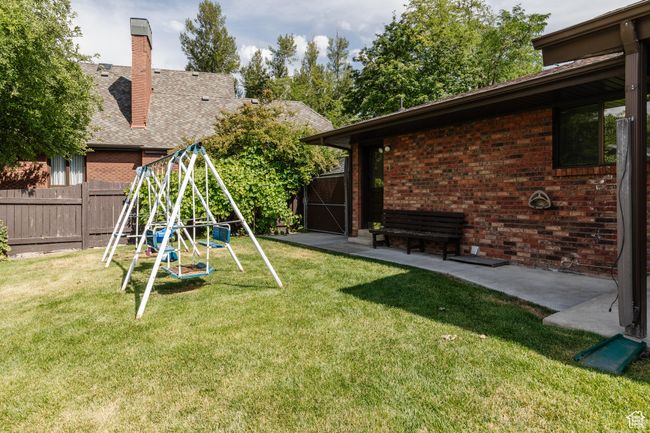View of yard featuring a playground | Image 38