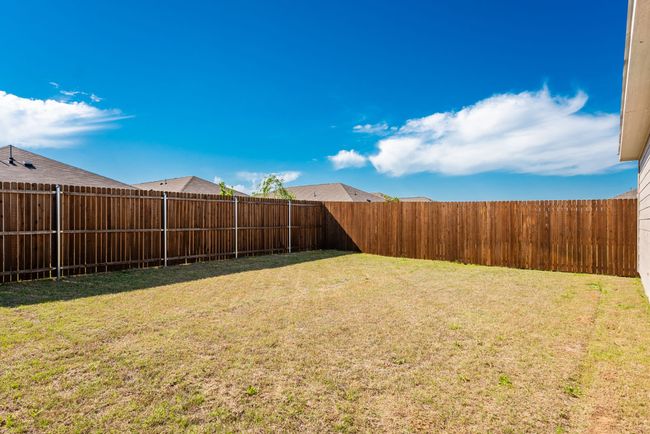 View of yard with a fenced backyard | Image 16