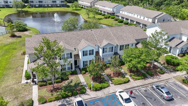 Aerial view of residential area with a large body of water | Image 30