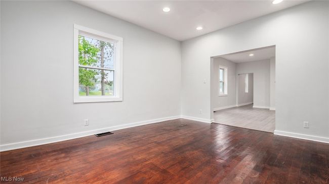 Family room with recessed lighting and dark wood-style flooring | Image 6