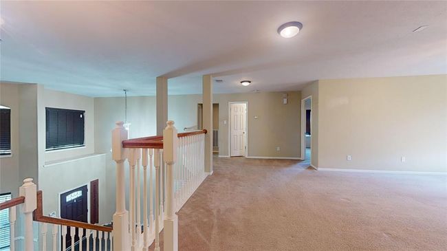 Spacious and versatile upstairs loft, perfect for a home office or cozy retreat. | Image 29