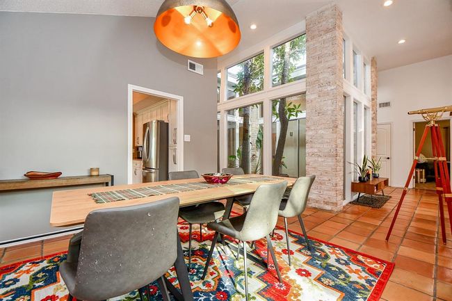 Your kitchen is just footsteps from this spacious dining area. | Image 13