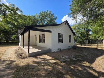 View of side of property with central AC unit and a patio | Image 2