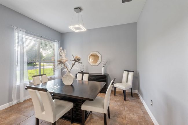 Large formal dining just around the corner from the kitchen. | Image 13