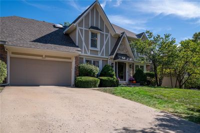 English style home with a front yard | Image 3