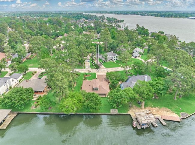 The home features a brand-new roof installed in 2025, with mature trees thoughtfully maintained to optimize solar coverage and energy efficiency. | Image 4