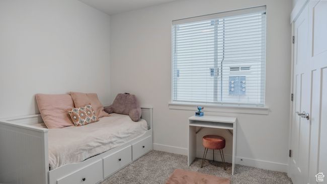 Bedroom featuring light carpet and baseboards | Image 19