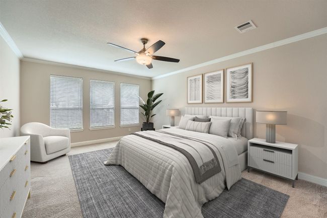 Bedroom featuring visible vents, ornamental molding, baseboards, light colored carpet, and a ceiling fan | Image 28