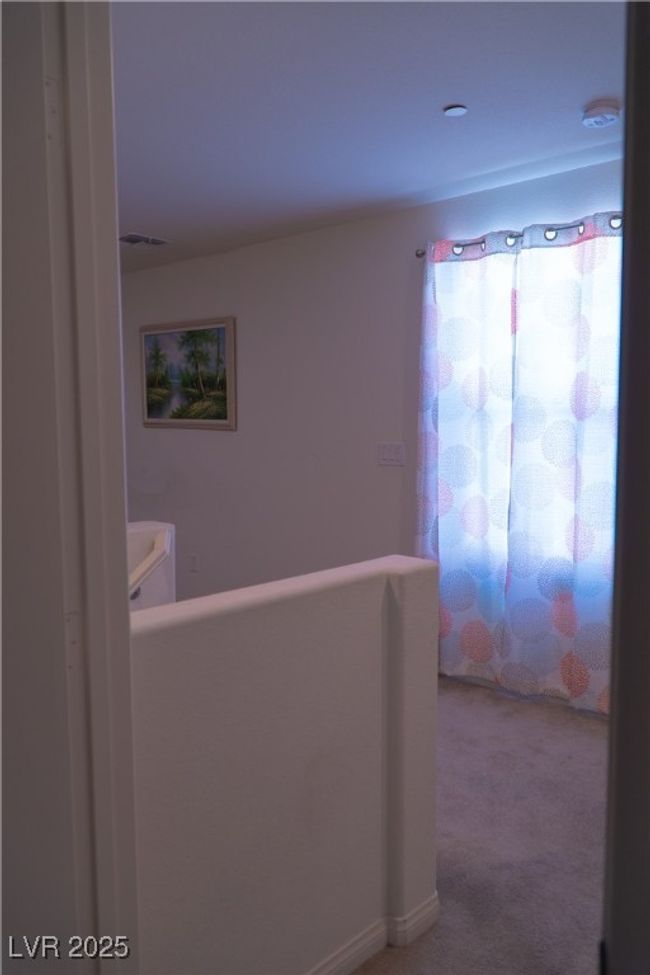 Hall with carpet flooring and visible vents | Image 39