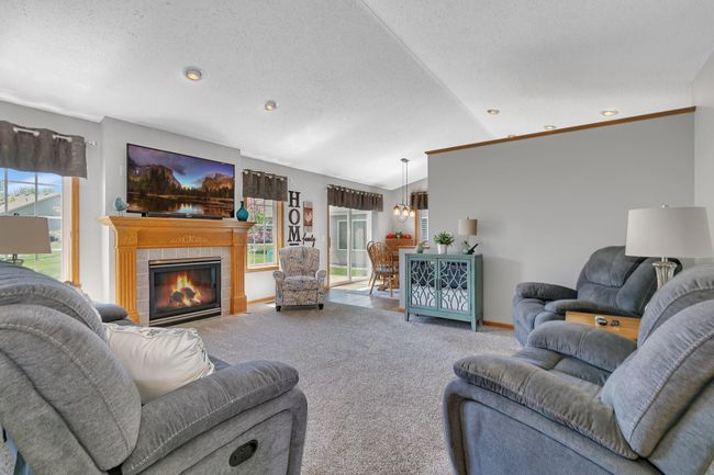 Fireplace is the focal point in this living room. | Image 13
