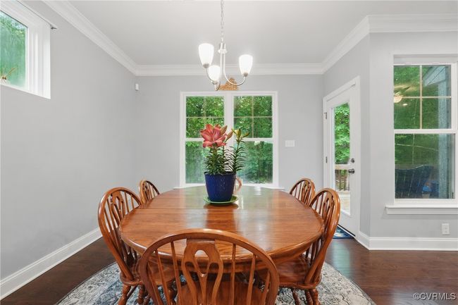 Bright dining space with backyard views and easy flow to the great room. | Image 9