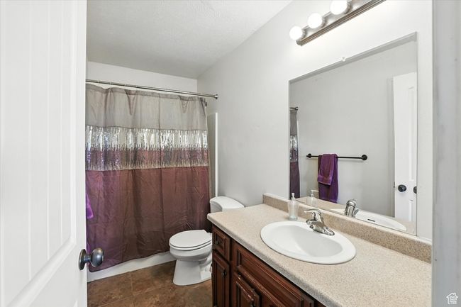Bathroom featuring vanity and tile patterned floors | Image 16