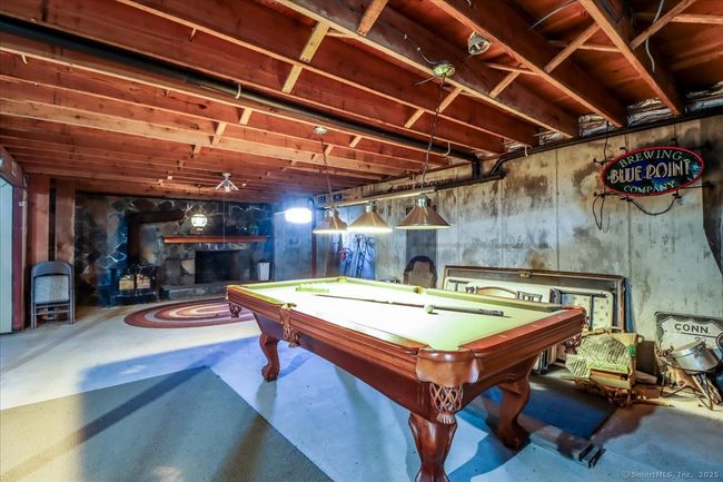 Basement includes this bonus recreation space and another fireplace. | Image 38